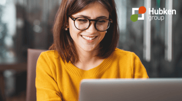 What is Moodle? Ultimate guide - woman smiling on laptop