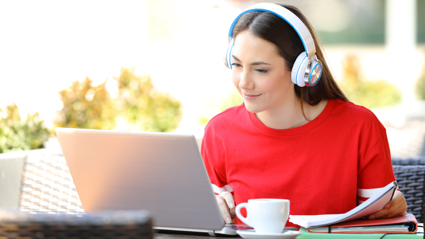 what is induction training? Woman learning at laptop