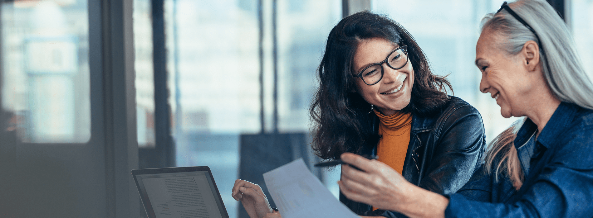 women smiling with Moodle Cloud