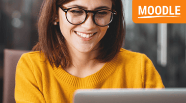 What is Moodle Guide - woman smiling at laptop