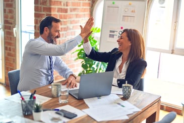 Workers high five office