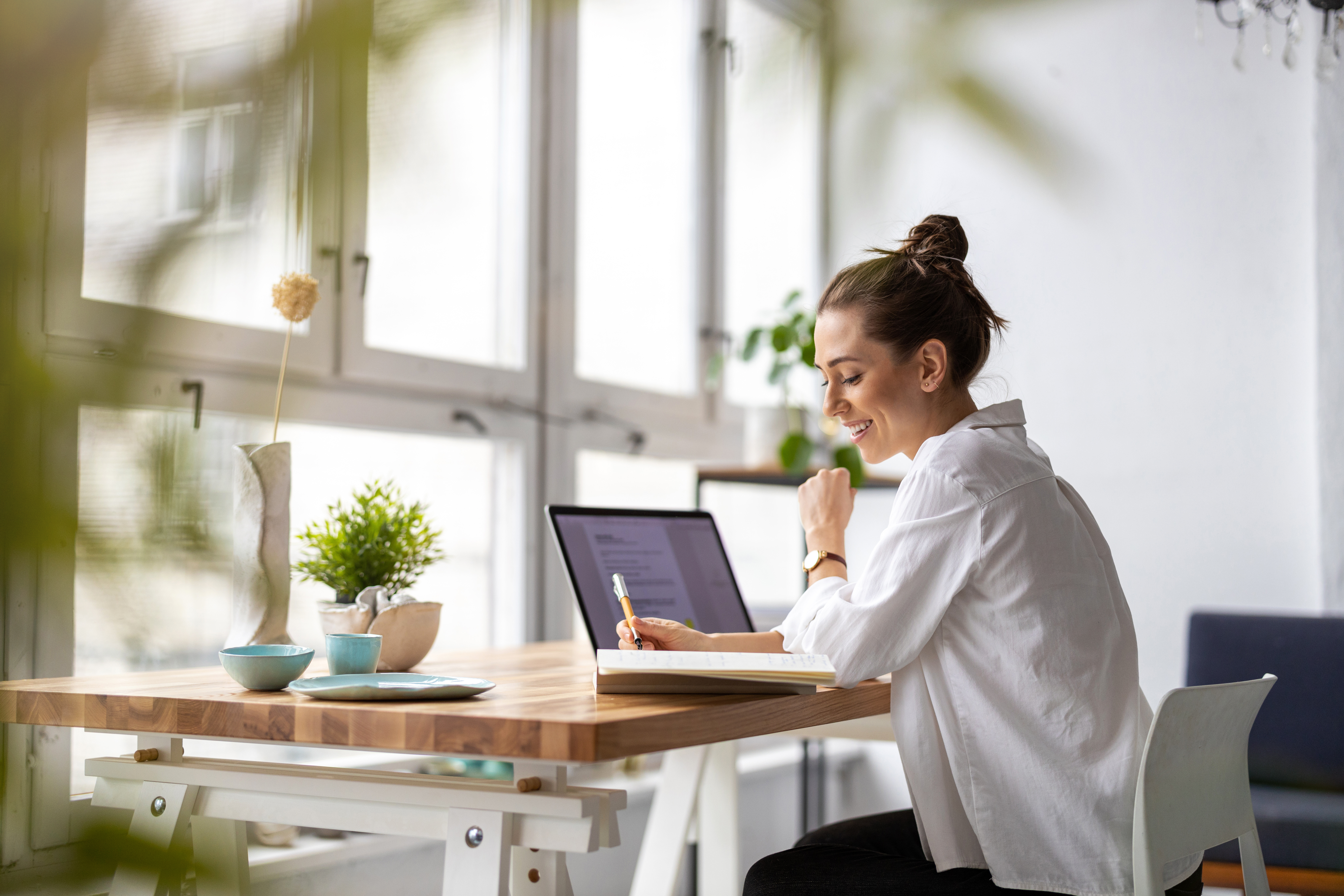 Happy female employee using customizable LMS