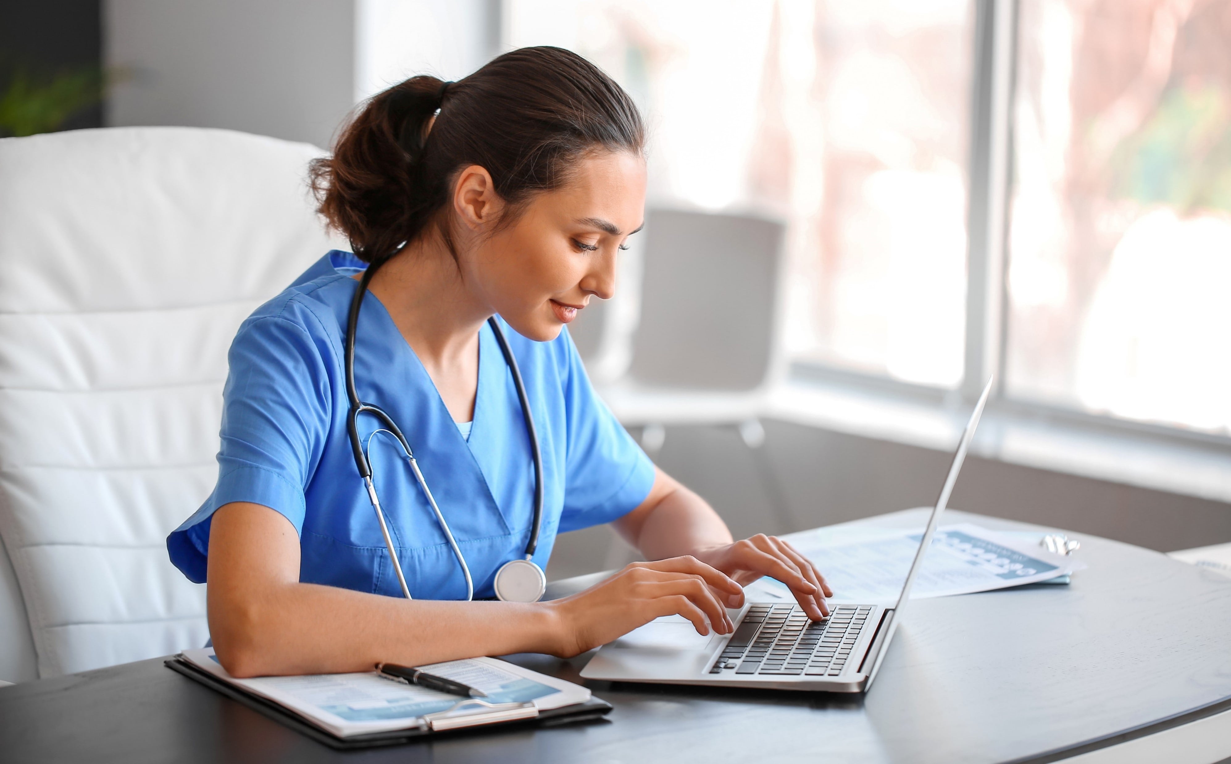 Nurse online learning on laptop