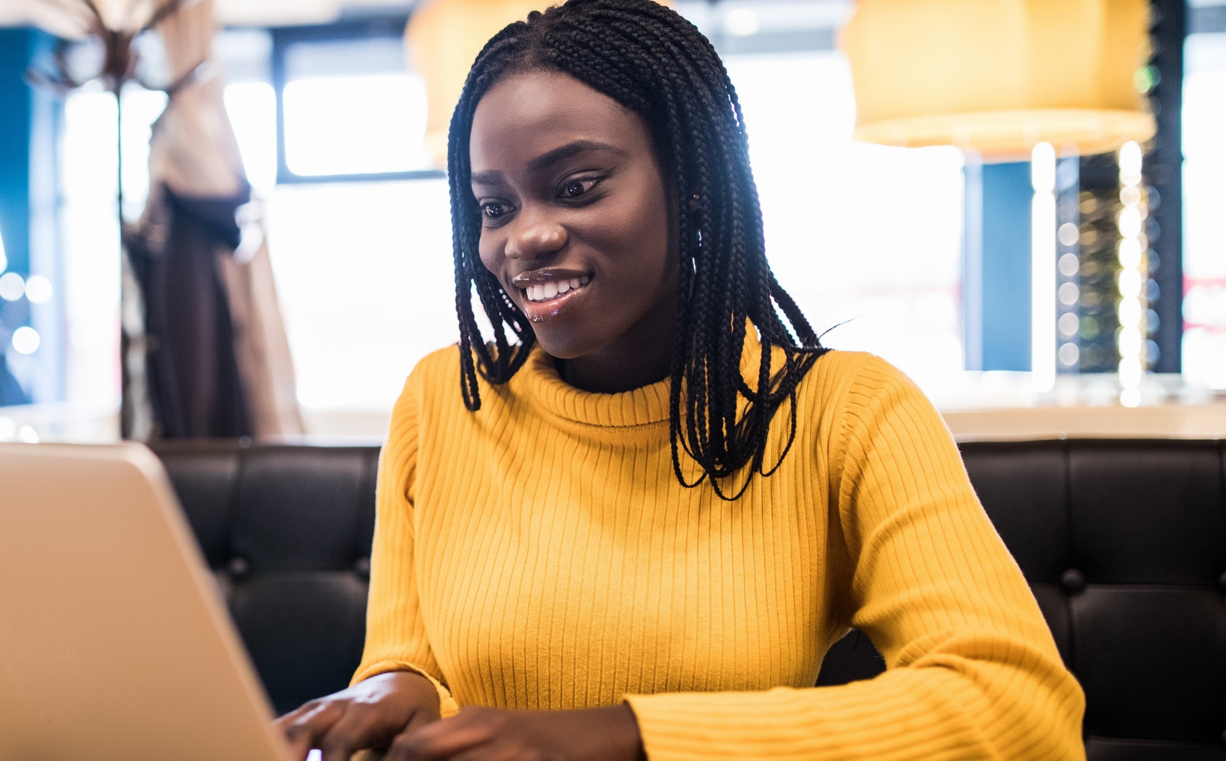 Happy female employee doing online training