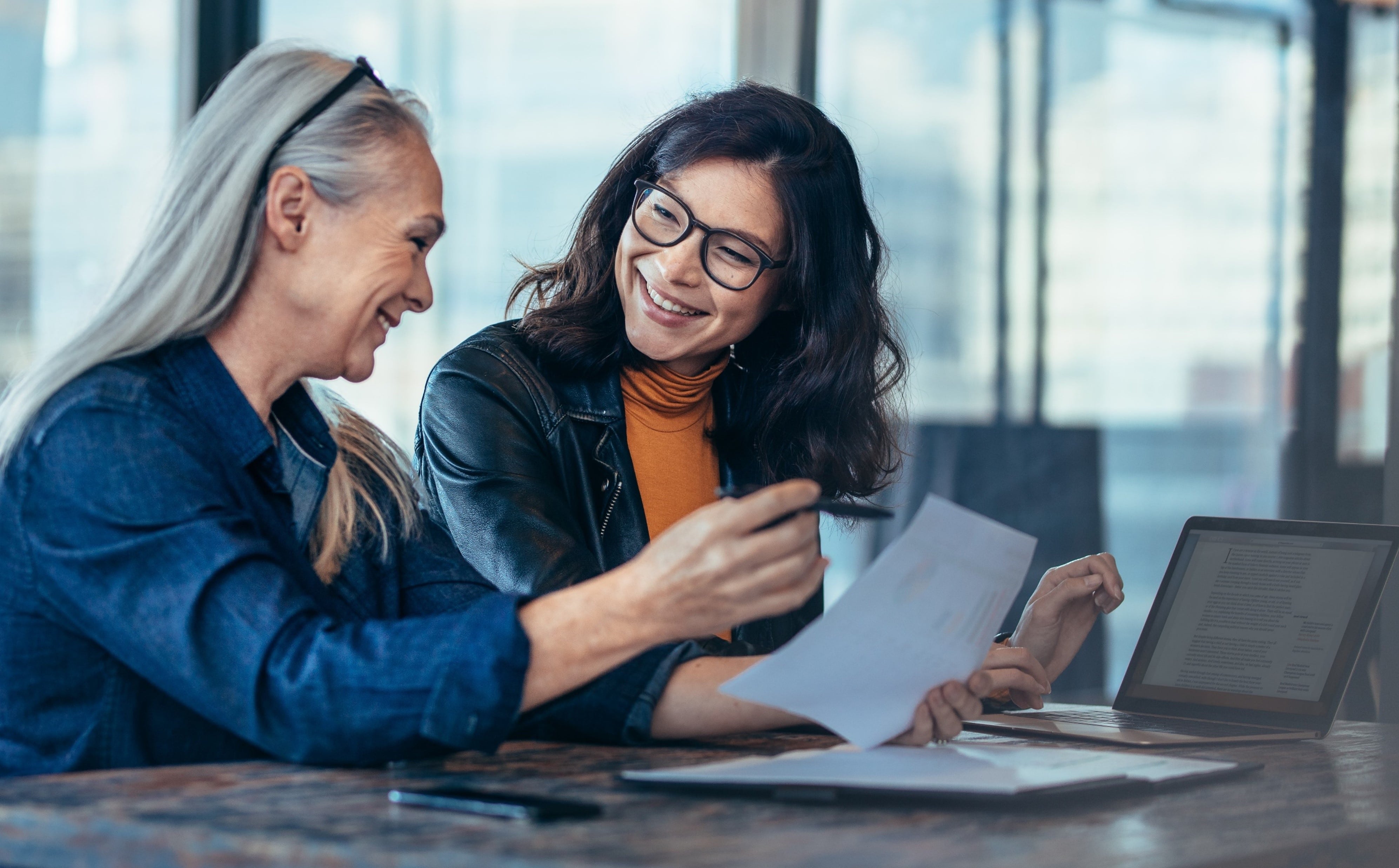 Happy manager providing employee with guidance 